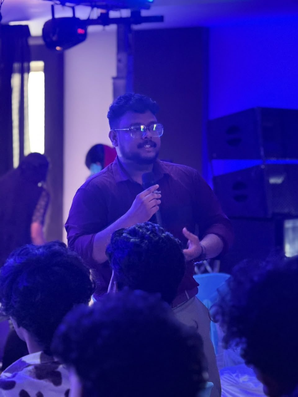 Addressing the audience with a microphone